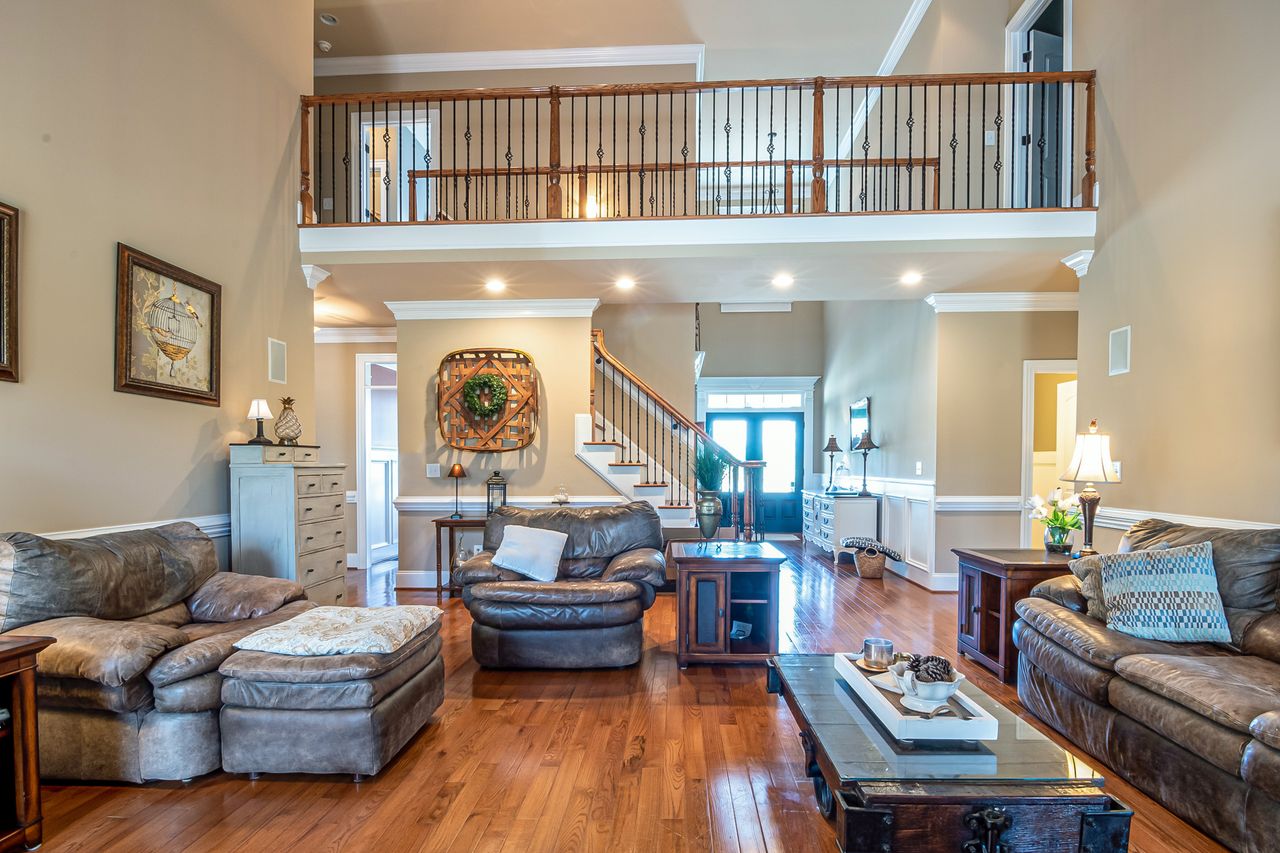A luxurious and cozy living room with modern decor, elegant furniture, and warm lighting.
